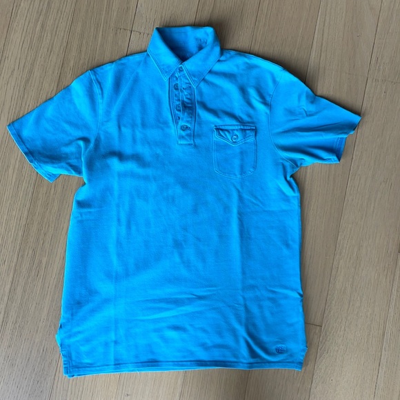 Folded and Hung Light Blue Polo Shirt - Picture 1 of 5